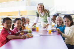 teacher and her students eating